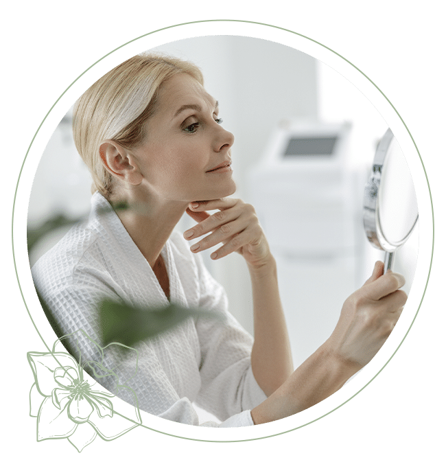 a woman standing in front of a mirror posing for the camera